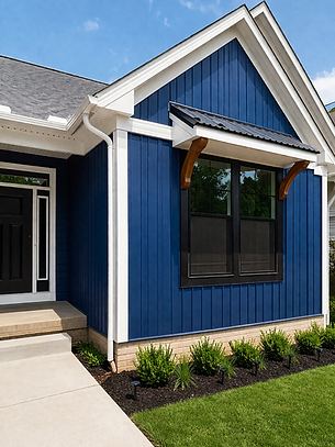 Modern suburban house with blue siding.png