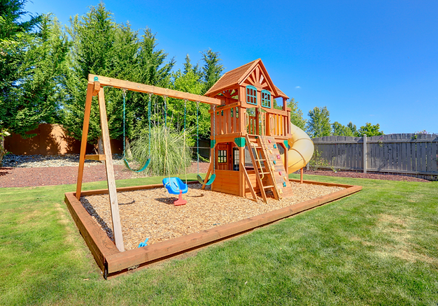 Custom backyard playset with slide and swings built by G&B Contracting – professional handyman and carpentry services in Caldwell, Idaho