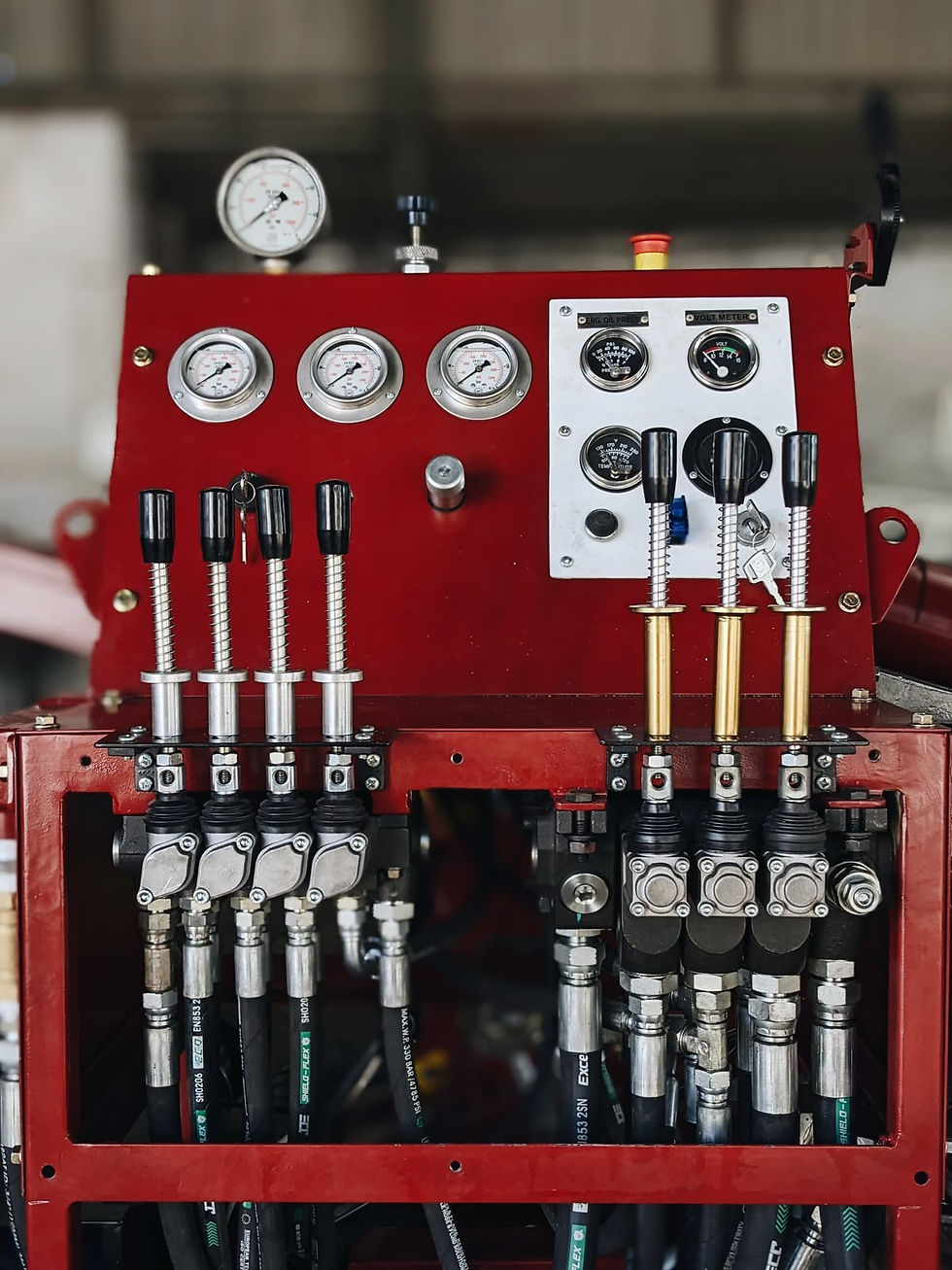 Close-up of CED100 diamond core drill rig operator controls and hydraulic control levers for shallow-hole mineral exploration.