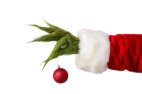 Green hairy hand of creature in Santa costume with Christmas ball on grey background_edite