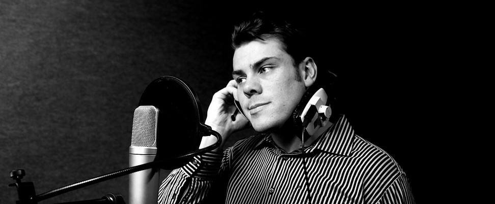 man recording music in black and white