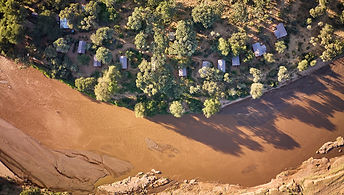This is a charming camp set along the banks of the Ewaso Nyiro River and shaded by Doum palms and other trees that make up this green belt of riverine forest in the Samburu National Reserve.

Samburu is an area of spectacular scenery; its dry plains are bisected by the meandering river, with the backdrop of Africa's dramatic mountains, including Mt Kenya. The 14 spacious tents have rustic and colourful African touches, offering all the comforts, including a private plunge pool on the deck. The lounge and dining area are decorated with in vibrant safari style. Elephants, monkeys, and impalas are among the camp's many regular wild visitors, whilst the reserve has a good number of lions, leopards and many other species endemic to northern Kenya.

There are plenty of activities on offer, from game drives, guided bush walks, cultural visits and lectures on Samburu culture. The lodge supports a local village by selling their beadwork and jewellery so do pick up a souvenir during your stay. 