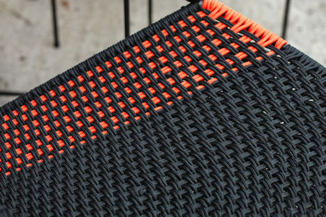 a close up of a black and orange knitted fabric