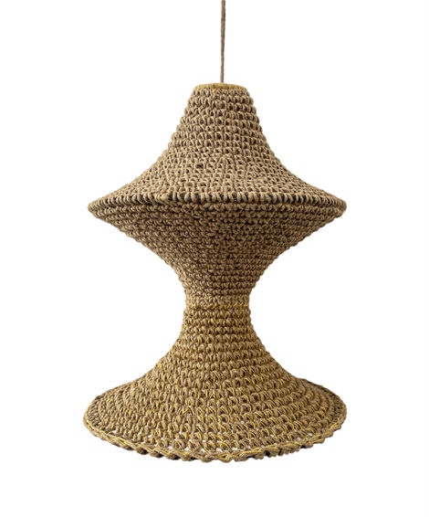 a crocheted object is hanging from a string on a white background