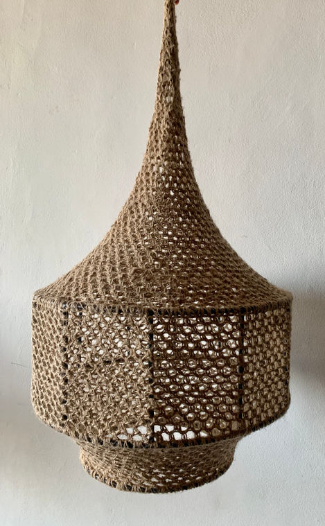 a brown knitted item is hanging from the ceiling