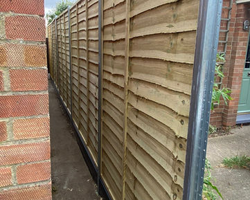 Fence near side of house