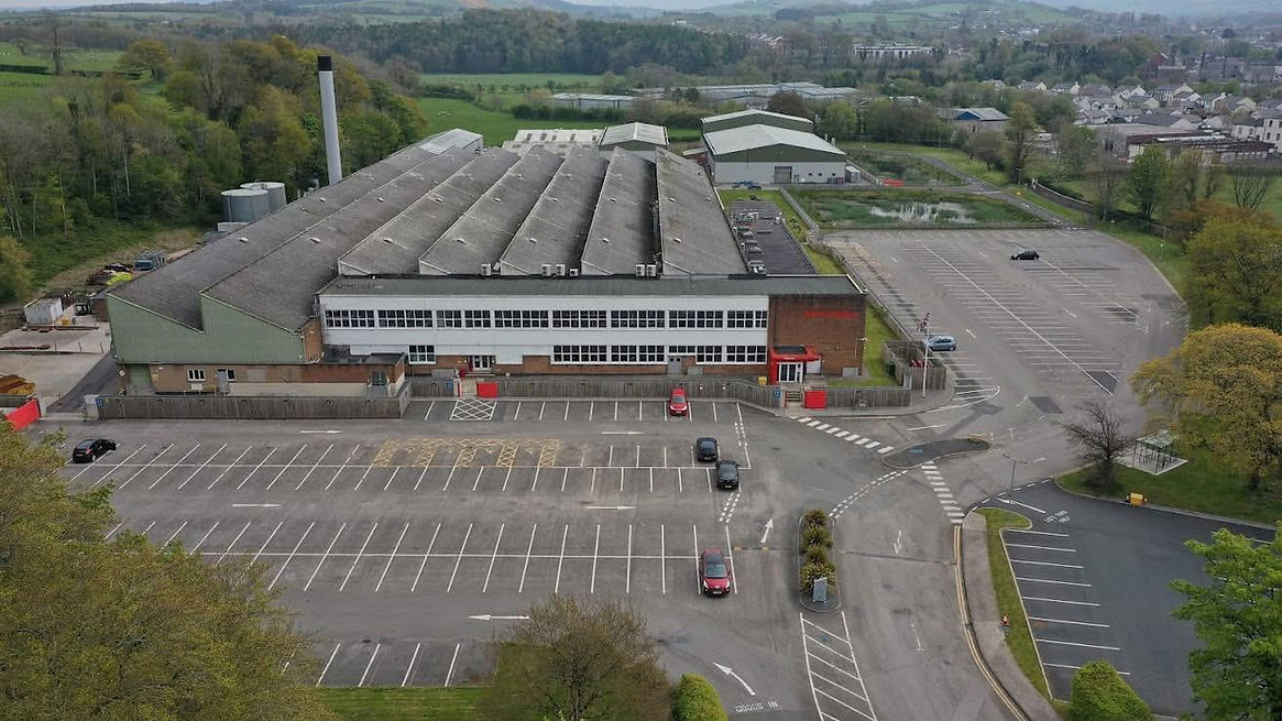 A warehouse's damaged flat roof in need of repair in Manchester
