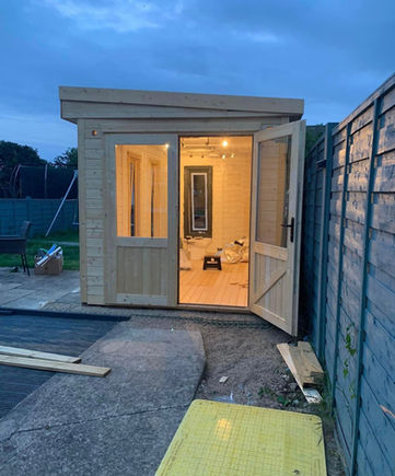 Summer house with lights on