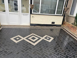 A bricked patio with a pattern