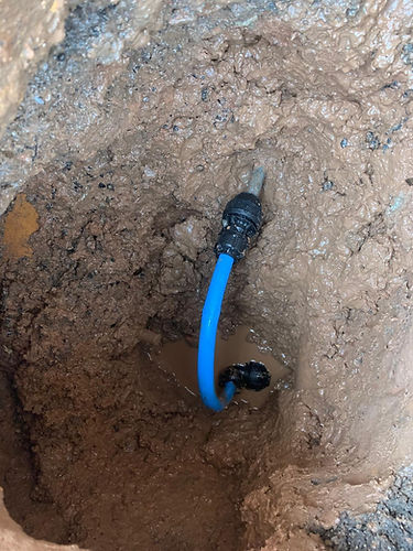 Curved water pipe in the ground