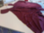 Two half circle skirt pieces with pocket pieces pinned right sides together beginning at the pocket tops and all the way down the side seams.