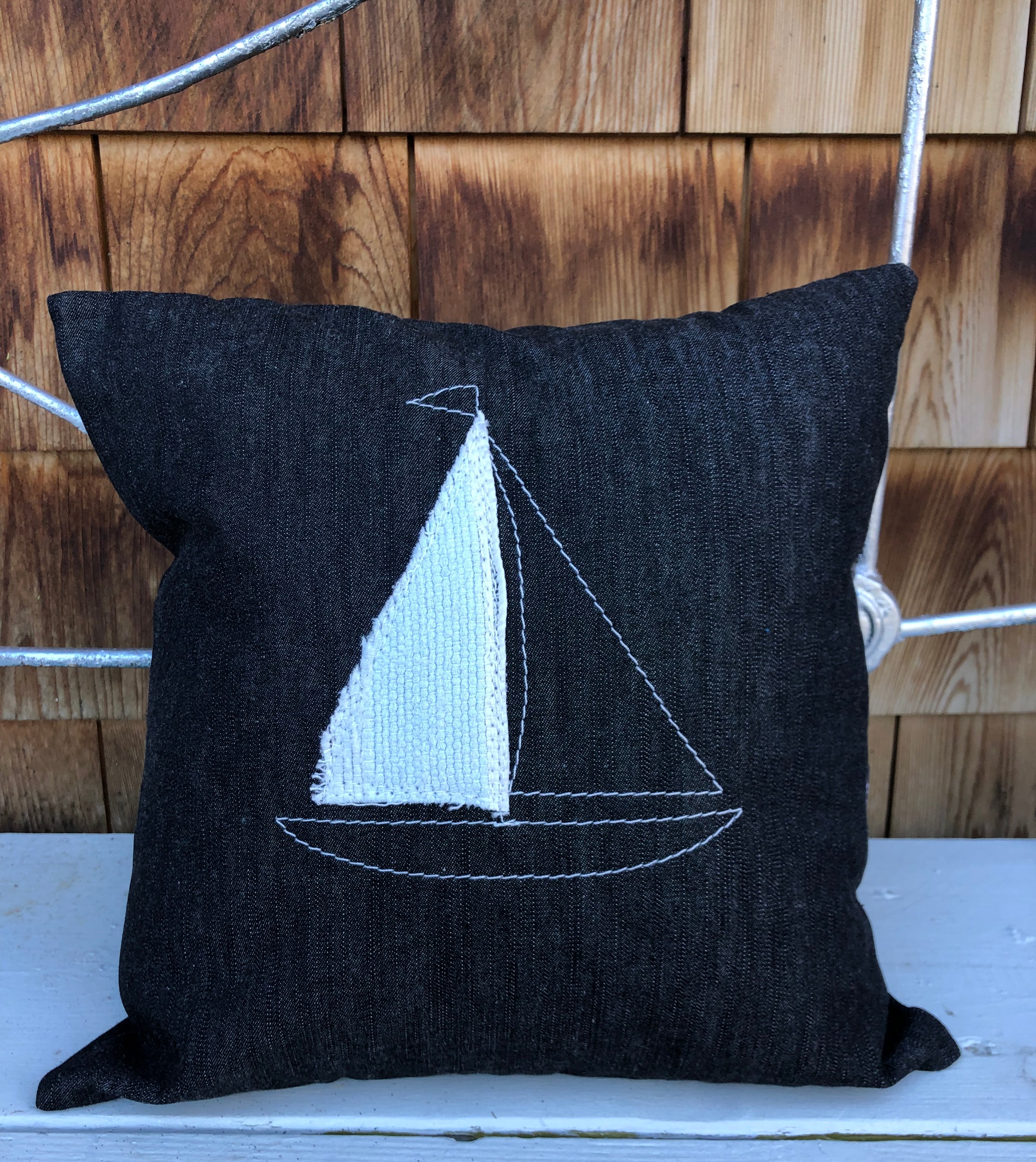 Housse de coussin avec voilier