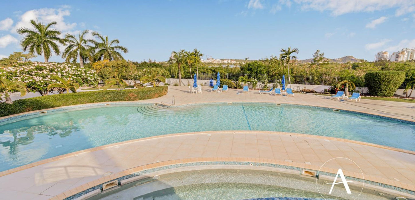 Luxury pool area with sun loungers in St Maarten real estate