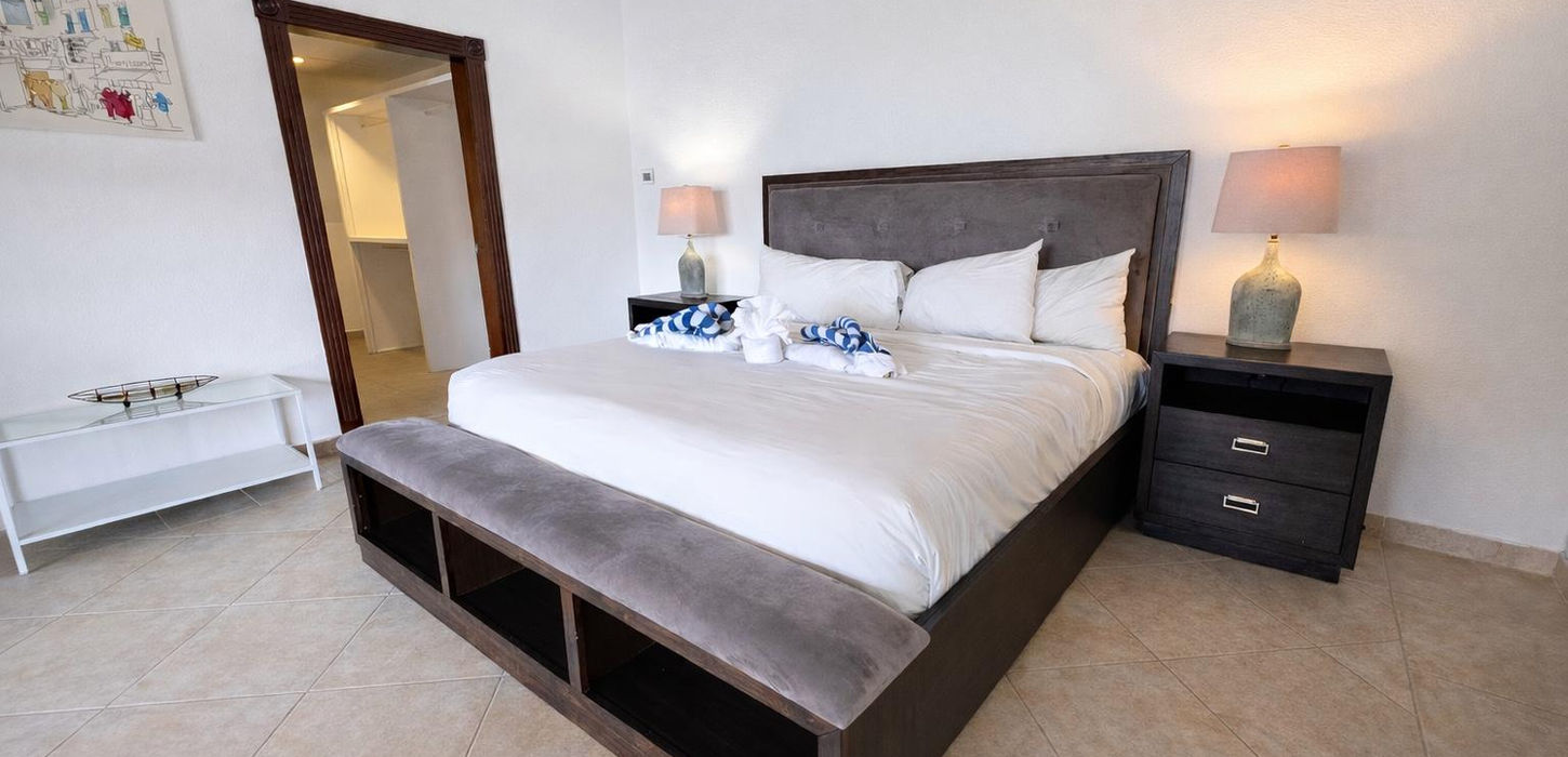 Elegant bedroom with ensuite bathroom in Sint Maarten condo for sale, luxury finishes
