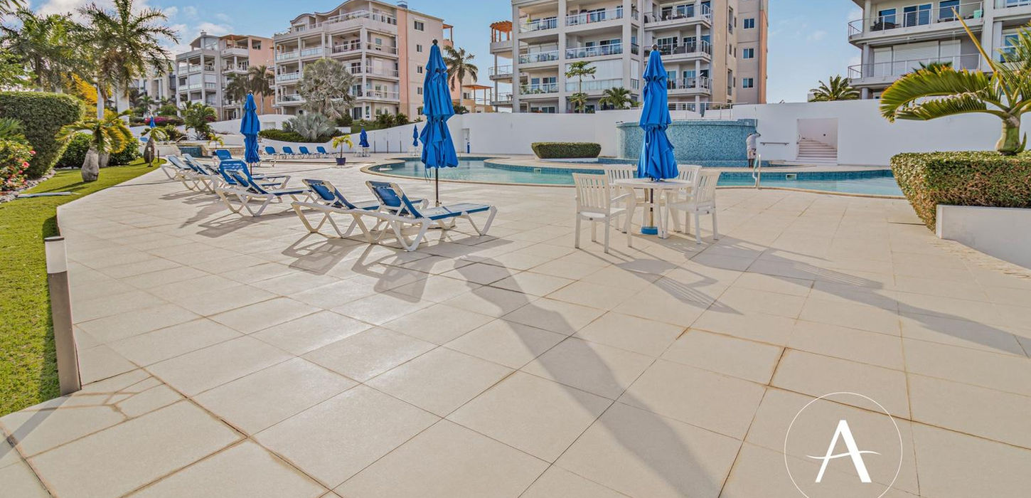 Tropical outdoor common area with pool in St Maarten real estate property
