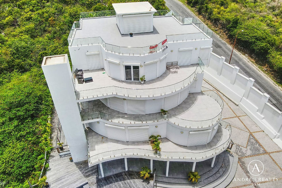 Aerial view of Le Diamant Blanc, a white four-level apartment building in Oyster Pond, Sint Maarten