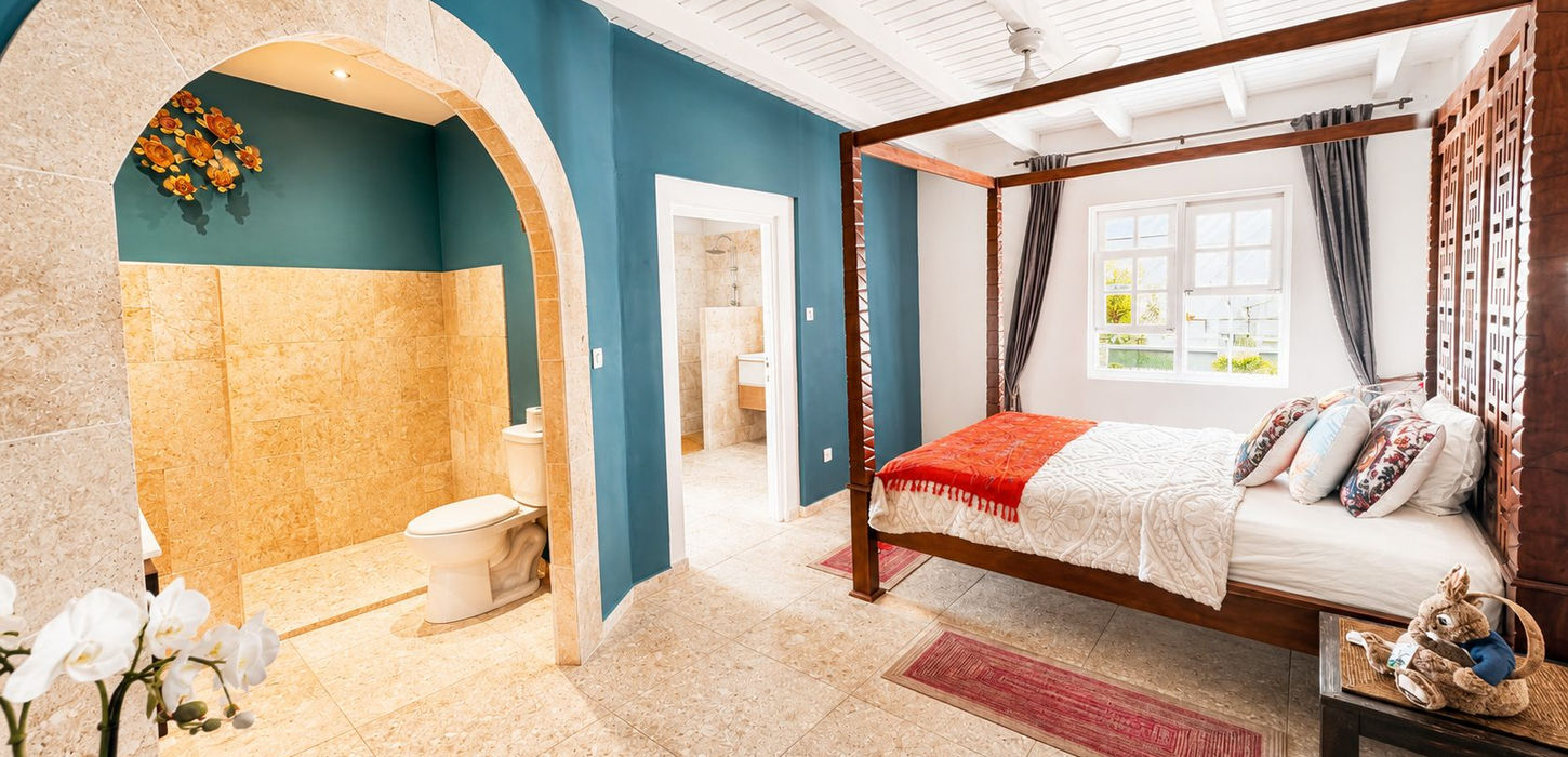 Luxury bedroom suite with open bathroom design in Sint Maarten villa for sale