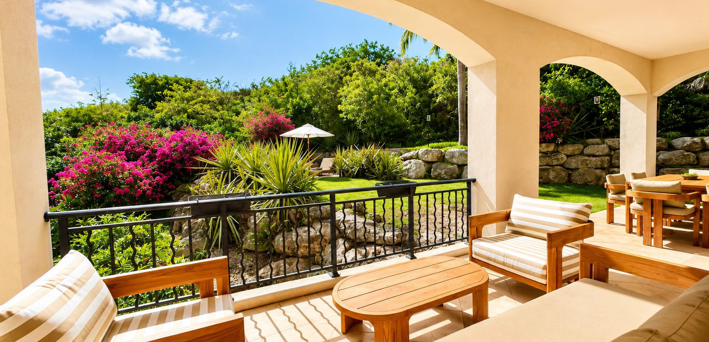 Private terrace overlooking landscaped garden at Porto Cupecoy luxury condominium in Sint Maarten