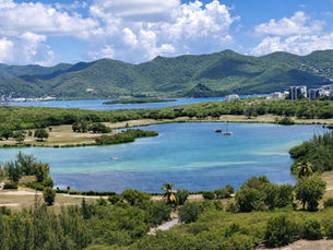 Lagoon, green hills and undeveloped land in Saint-Martin