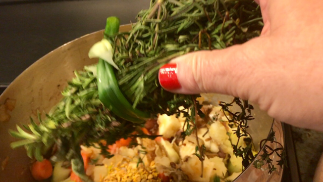 Tying herbs with a green onion