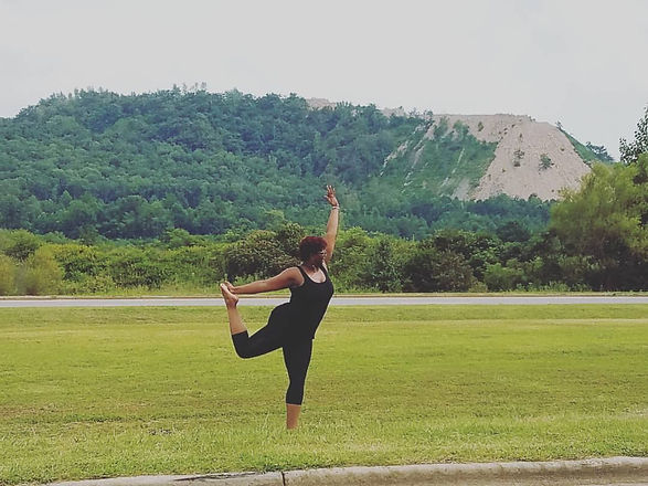 sher yoga in grass.jpeg