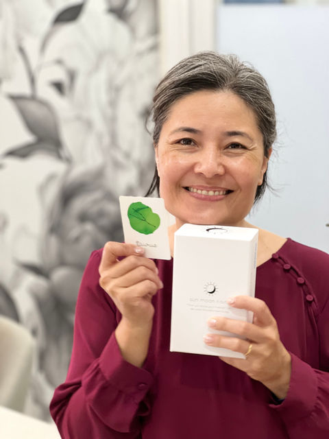 Dr. Inoue-Cheng holding a game created by a patient