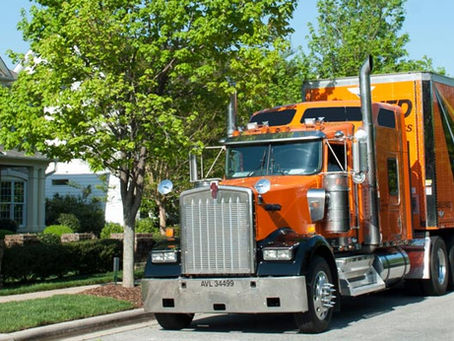 Lanigan moving truck in Jackson MS in front of a home.