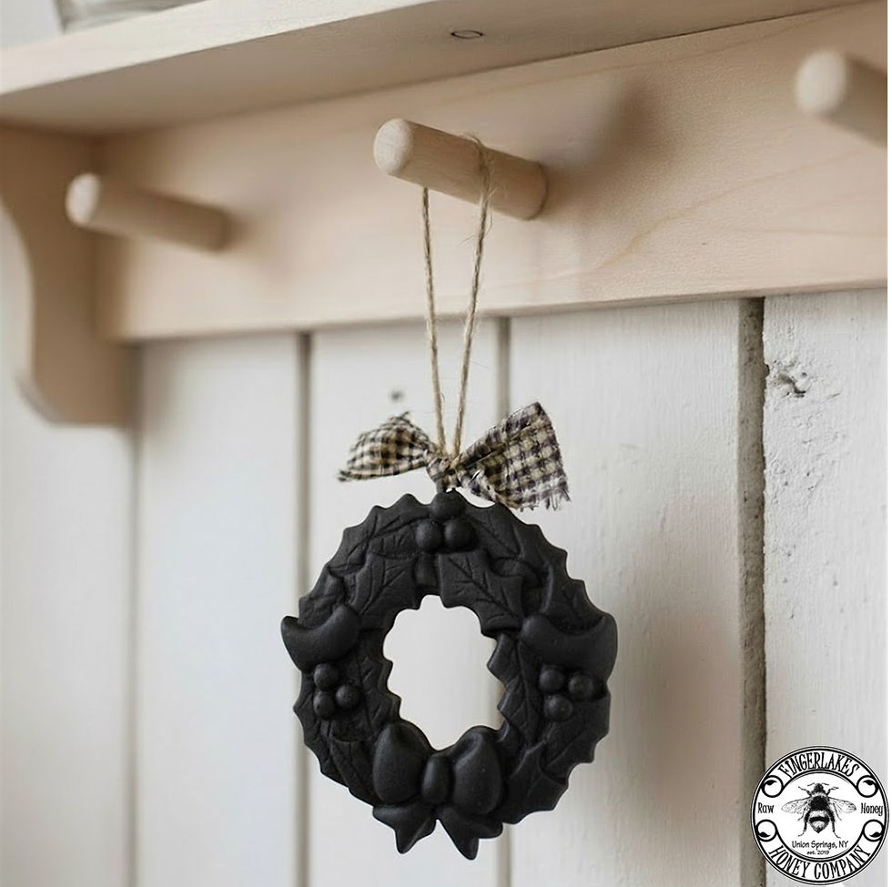 Thumbnail: black beeswax wreath ornaments on a shaker peg shelf