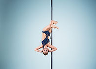 strong-graceful-young-girl-performing-acrobatic-exercises-pylon (1).jpg