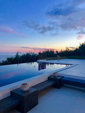 With the sun setting over the Atlantic