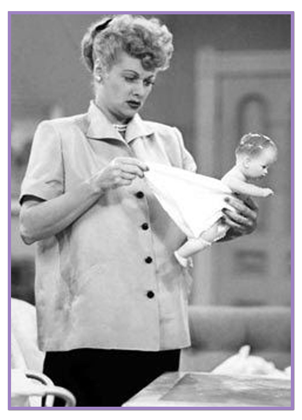 Thumbnail: Photo of Lucy using one of these dolls on the I Love Lucy show, to learn how to diaper a baby.