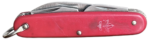 Closed red pocketknife with metal tools folded inside and faded logo.