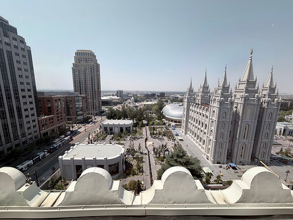 Elevated view of Temple Square from The Roof restaurant, with the Salt Lake Temple and surrounding downtown buildings below.