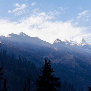 Blue skies, snowcapped mountains from Himachal Pradesh