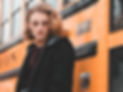 man in black zip-up jacket standing besi