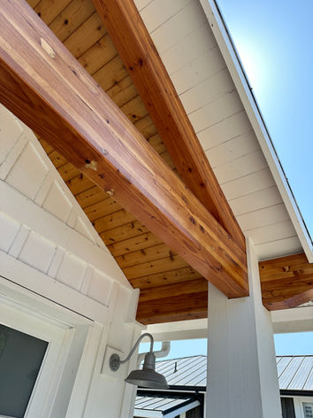 exterior beam with clear cedar stain