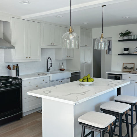 kitchen cabinets painted the color alabaster. walls painted white.