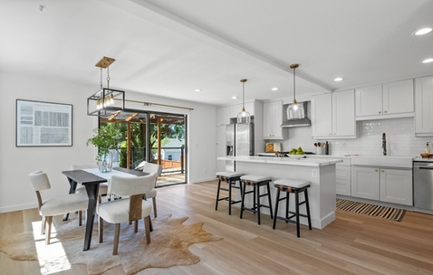 kitchen and dining room with oak floors and fresh paint in the color alabaster