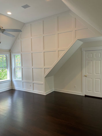 white painted trim work on wall