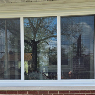 large 3-lite slider window brick exterior in Griffith IN