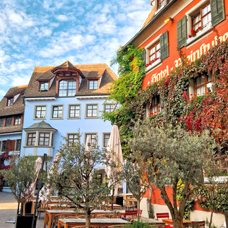 Half-timbered houses and flowered planters on a Meersburg square.