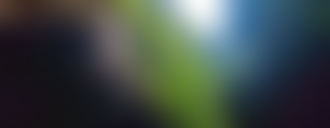 Sunbeam through a rock window in the gorge ceiling, bright green leaves beyond.