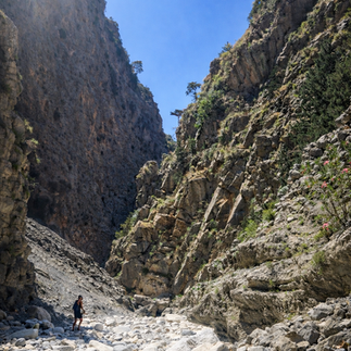 Hiker walking through a rocky canyon during a sabbatical trip