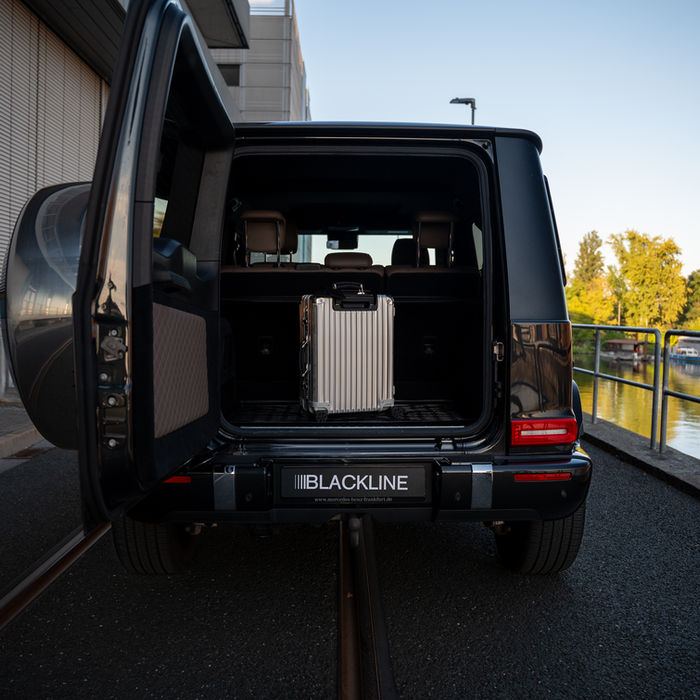 Rimowa suitcase in the trunk of a G-Class