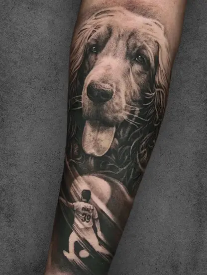 Realistic dog portrait tattoo on male forearm, featuring a lifelike Labrador and a silhouetted football player.