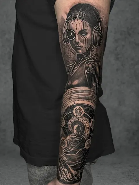 Futuristic-themed tattoo featuring a robotic woman and symbols, complemented by a Buddha figure in the lower half