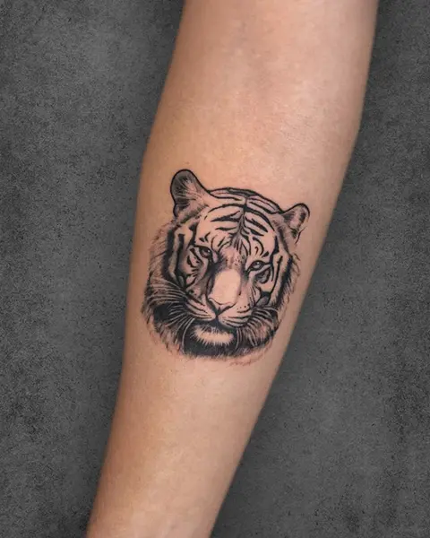 small tiger portrait tattoo