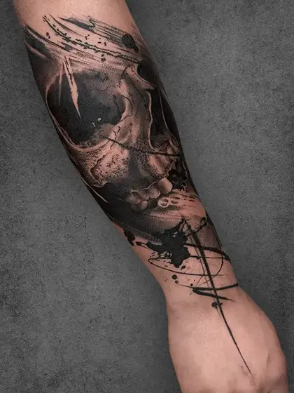An exploration of life and decay, this skull piece uses bold contrasts and rough textures to convey a haunting sense of realism. The splashes of ink add an abstract touch, creating a dynamic flow that’s both unsettling and mesmerizing