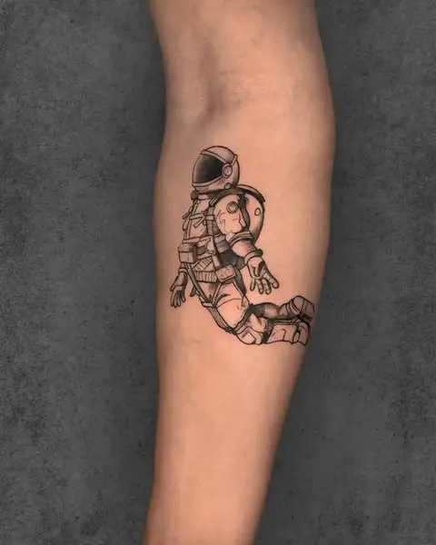 small astraunaut tattoo