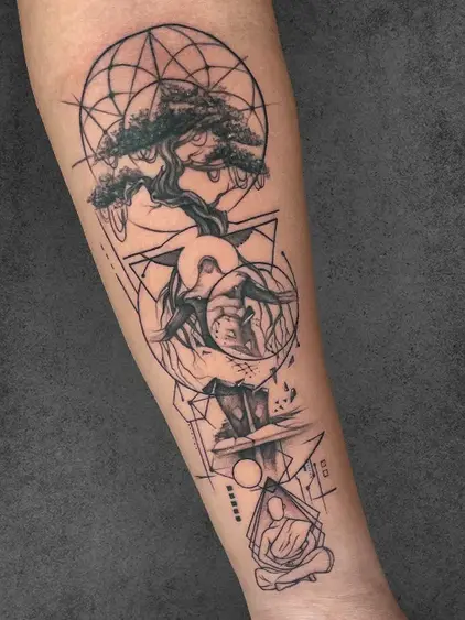 A conceptual tattoo blending a tree, a meditating figure, and sacred geometry, symbolizing growth, inner peace, and balance, inked by a student of the Complete Course in Tattoo